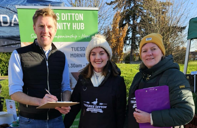 John signing residents' petition 